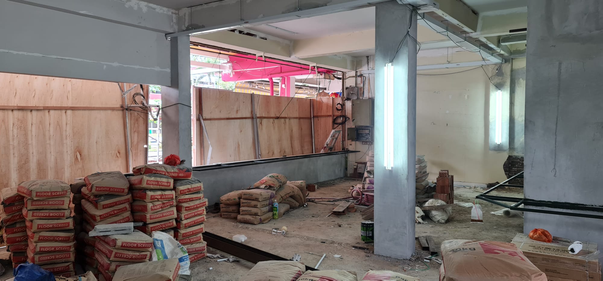 Raw office infrastructure in HDB commercial unit before professional security system installation