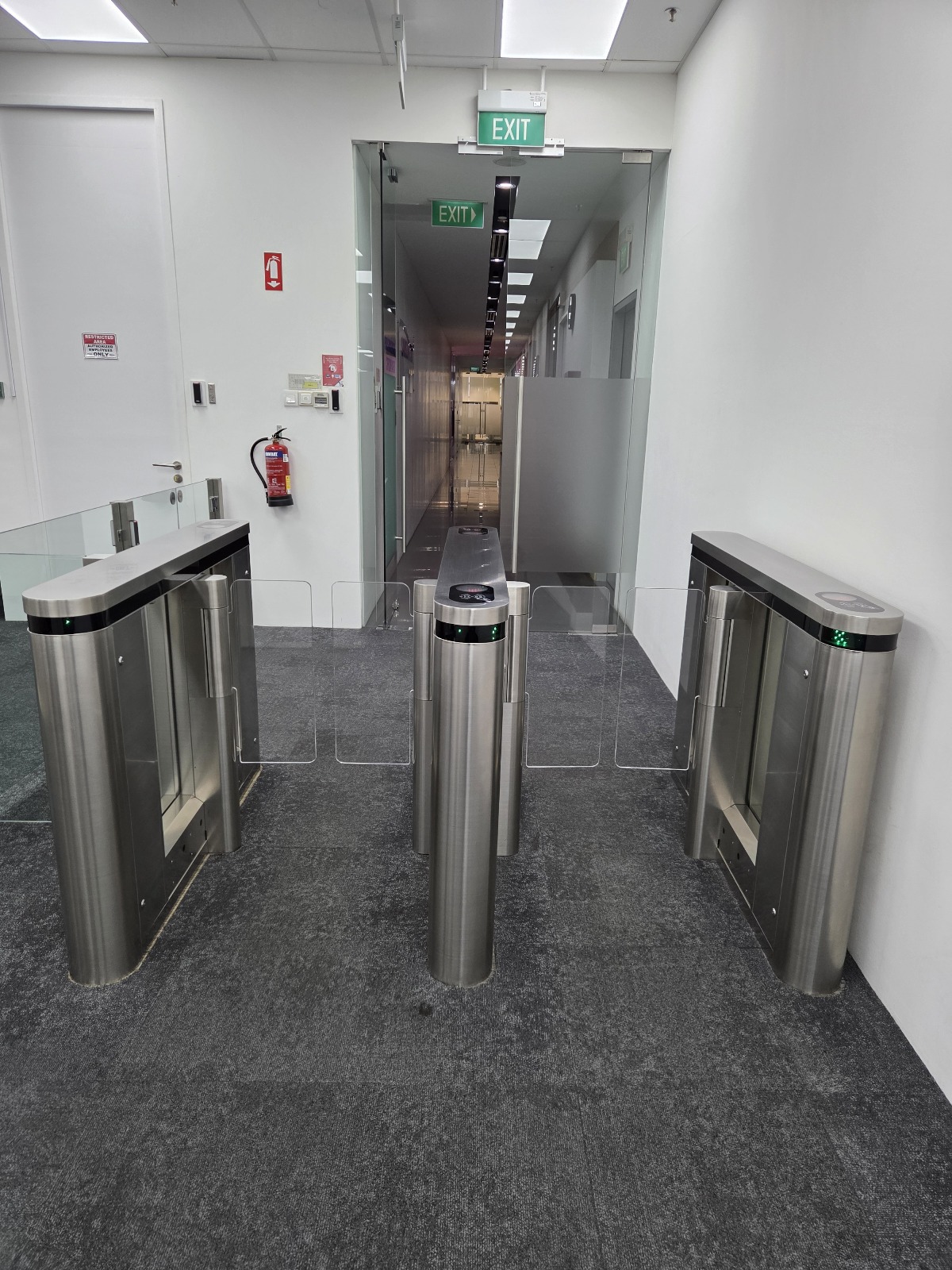 Integrated security turnstile system at a modern Singapore office lobby