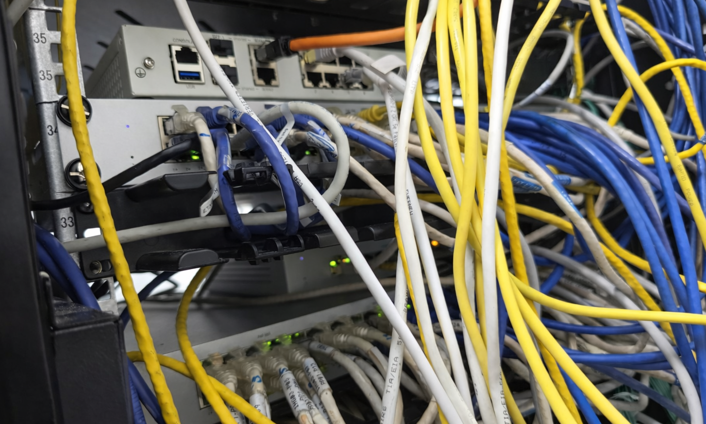 Poorly planned network cabling in a bare HDB office unit showing disorganization and lack of IT infrastructure planning